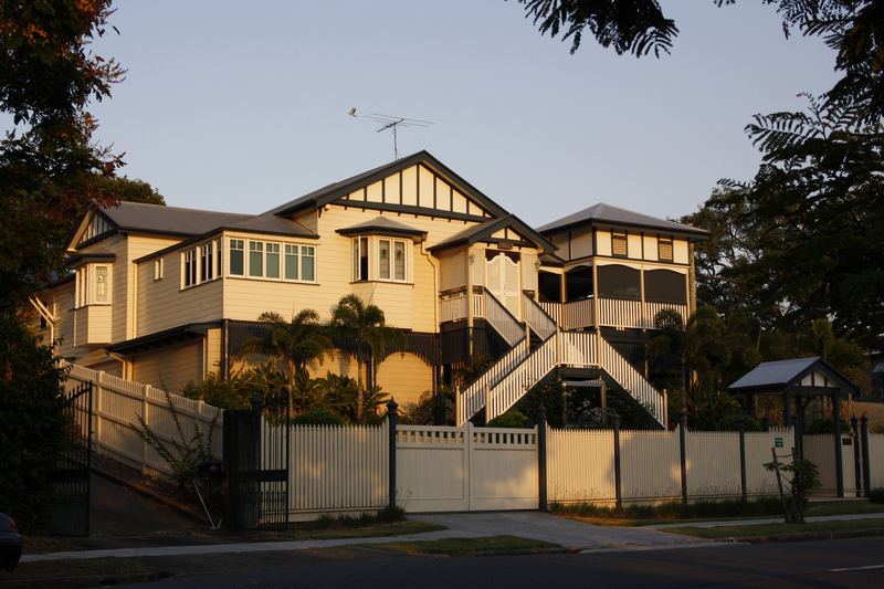 Two storey Queenslander with timber stairs and lattice in East Brisbane